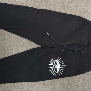 Black Evil Eye Italian jogger Pants. One size fits up to 12. NWT